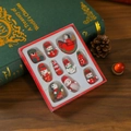 Detailed view of 12-piece wooden Christmas ornaments set in a festive gift box - Rocking Horse Style / 12pcs Set