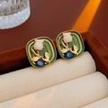 Vintage green enamel pearl stud earrings featuring a white tulip relief and gold accents - Silver Earring Post Green Enamel White Flower Stud Earrings