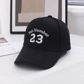 Close-up of Est.Number 23 white embroidery on a premium black cotton baseball cap - One Size / Black & White