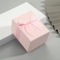 Pink rectangular gift box with matching ribbon bow on a white display stand - 10*7.5*7cm / Pink