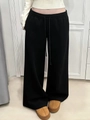 Detail of black wide-leg sweatpants showing elastic drawstring waistband and knit texture - S / Black Fleece Lined