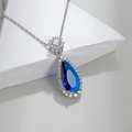 Elegant silver necklace with blue teardrop-shaped gemstone surrounded by zircon - Royal Blue Style