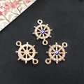 Golden steering wheel charm with blue evil eye and sparkling rhinestones for jewelry making - KC Gold - Ship Wheel Evil Eye Connector - 14x20mm