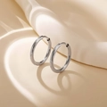 Polished silver stainless steel hoop earrings with hinge closure on cream background - Steel Color 2*14mm