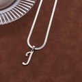 Silver-toned capital J letter pendant necklace with elegant snake chain on brown suede - Letter J