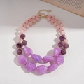 Detail of double-layer necklace with pink and purple acrylic beads and golden accents - Purple