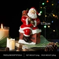 Resin Santa Claus on chimney figurine with dimensions 17.5cm height and gift bag - Santa in Chimney Style B
