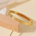 Gold-plated stainless steel open cuff bracelet with engraved Love and heart patterns - Heart Carved Bangle (I Love You Forever)
