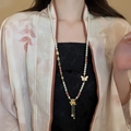 New Chinese long beaded necklace with pearls, pink butterfly charms and golden tassels - Style 25 Necklace - White Gold Pink