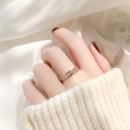 Elegant rose gold titanium ring with single row of cubic zirconia worn on hand - US 6 / Rose Gold Single Row