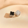 Detail of clover earrings with black enamel and zircon pavé on champagne satin silk - Silver Frame Black Agate & Zirconia