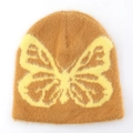 Detail of soft brown faux mink beanie featuring a large yellow butterfly jacquard pattern - L(58-62cm) / Yellow