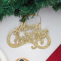 Scritta Merry Christmas con glitter dorati su sfondo di rami di pino - Oro