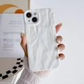 Close-up of white wrinkled silicone iPhone case held by a hand with lace glove - White / iPhone 15