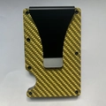 Minimalist carbon fiber RFID wallet in bright yellow finish with matte black money clip - Gold