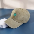 Close-up of olive green washed cotton baseball cap with alien eating pizza embroidery - One Size / Khaki