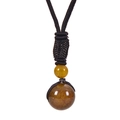 Detail of 16mm blue tiger eye stone pendant with hand-woven rope and brown marble texture - Dragon Vein Agate