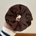 Dual-sided brown corduroy and floral print scrunchie hair tie held in hand - Coffee Floral Woolen Scrunchie