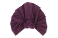 Detailed view of the twisted knot design on a dark purple stretch knit turban headscarf - Deep purple