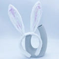 White plush bunny ear headband with iridescent holographic sequins on blue background - White Fluorescent Bunny