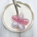 Pink and white gradient plumeria flower hair claw clip with a glossy resin finish - Pulled Pink