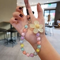 Colorful macaron beaded phone strap with a large transparent yellow jelly flower charm - Yellow Flower Multicolor Beads