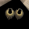 Macro detail of golden irregular firework hoop earrings on a black display surface - Gold (Ear Buckle-Gold)
