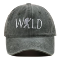 Detailed close-up of WILD embroidery and bigfoot silhouette on washed dark gray baseball cap - Adjustable / Green