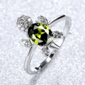 Turtle ring in silver finish with oval green gemstone and sparkling white stones - Olive Green Zirconia