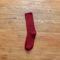 Vertical ribbed knit crew socks in deep red combed cotton on a wooden background - One Size / Plain Top Wine Red (1 Pair)