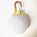 Spherical LED pet safety tag with golden metal clip for nighttime visibility - Battery Operated Cardboard Packaging / White