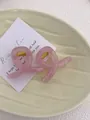 Macro detail of translucent pink jelly hair claws with golden metal springs on a ceramic tray - Mini Butterfly Clip X-Shaped (Approx. 4cm) / Jelly Pink