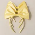 Three yellow satin bow headbands for girls with silky shine on corrugated background - Satin Bow / Yellow