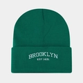 Detail of white Brooklyn embroidery on a dark green ribbed knit beanie hat - Malachite green
