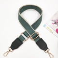 Close-up of green cotton shoulder strap with beige edges and golden metal hardware - Green & Green