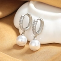 Elegant 18K gold-plated pearl drop earrings featuring micro-paved zircons on silk background - Platinum