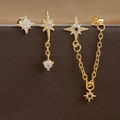 Macro shot of gold star tassel earrings set with micro-pave cubic zirconia and blue crystals - Style 3 (E1603-3) / Gold