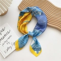 Elegant geometric print silk scarf in bright yellow and blue on a wooden tray - 70cm / Knit Texture Yellow Edge