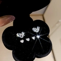 Glinsterende zirkoon vlinder- en hartoorbellen in een zwarte bloemen doosje - Zilver - Hart