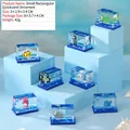 Jouet liquide acrylique avec dauphins et pingouins flottants sur fond bleu océan - Cube d'Animaux Marins