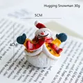 Miniature resin Christmas snowman figurine wearing red hat and blue gloves, 5cm wide - Style 13 (Hugging Snowman)