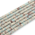 Macro shot of colorful imperial stone flat disc beads with natural blue and brown textures - Snakeskin Stone Pattern