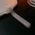 Detailed macro view of silver tassel chain ear cuff showing polished metallic luster - Silver (Silver Pin)