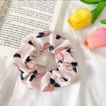 Pink scrunchie with strawberry pattern on white fabric with tulips and book - White Pink Pear