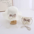 Detail of children's straw hat and bag with delicate lace edges and satin bows - Hat + Bag Set / Cream