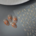 3D feather nail stickers with gold foil accents on almond nails in pastel blue and pink - 3D Pastel Feather(CO-479)