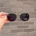 Detail shot of green foldable kids sunglasses featuring UV400 protective dark lenses - Green