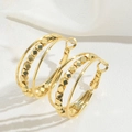 Minimalist multi-layer gold hoop earrings with geometric beads on white satin fabric - Triple Layer Hoop Style
