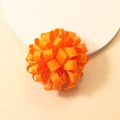 Bright orange grosgrain ribbon bow hair tie featuring layered petal flower texture - Orange Red