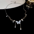Detail view of silver butterfly necklace with sparkling rhinestones and white pearls - 14# Butterfly Crystal Teardrop Diamond And Pearl Necklace